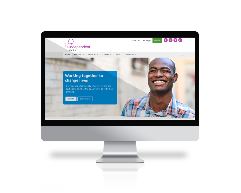 Computer monitor displaying the homepage of the Independent Lives website with a smiling man.